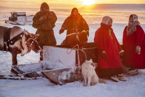 Far North, Yamal Peninsula, Day of the reindeer herder, local residents in national clothes of Nenets. Nadym, Russia - February 23, 2020